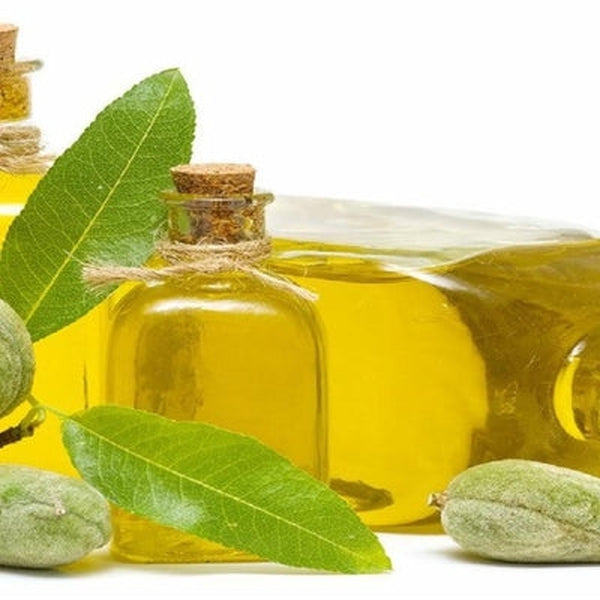 A sleek glass dropper bottle of 100% pure Abyssinian oil, placed on a neutral background with a few golden oil drops beside it, highlighting its lightweight and fast-absorbing texture.